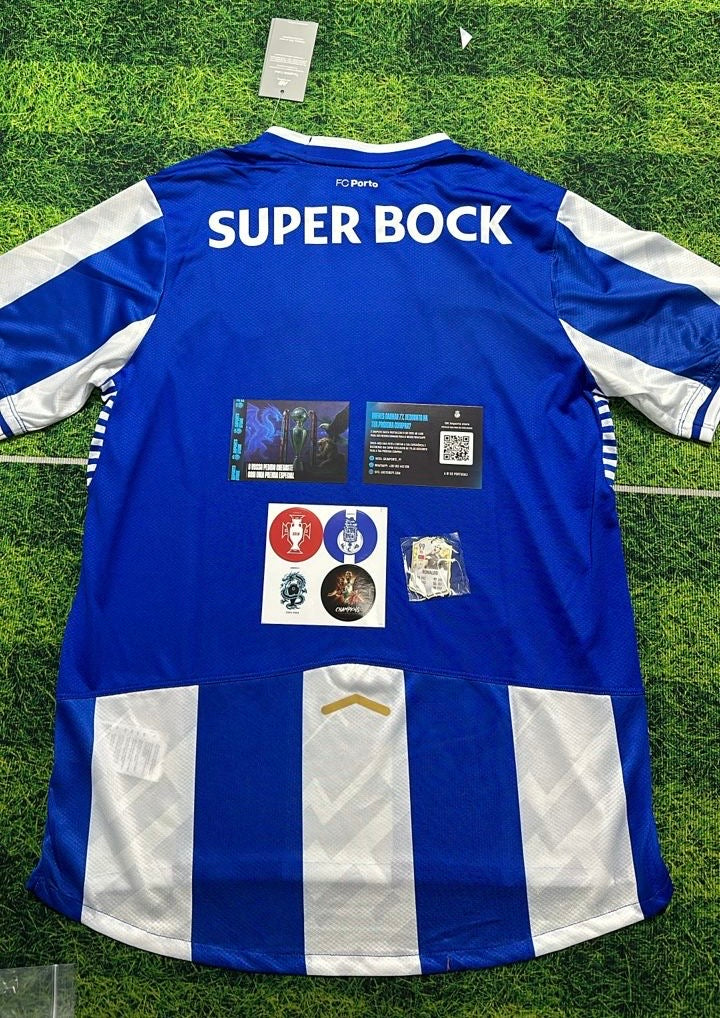 Camiseta primeiro equipación azul/blanco 2025/26 simbolo bordado