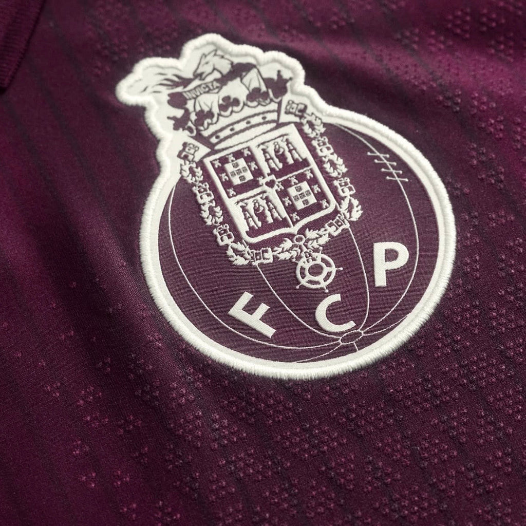 Camiseta dragón ALTERNATIVA 2026/27 rubi secundario